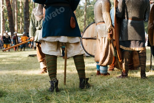 Preview: Medieval soldiers preparing for battle on the battlefield, outdoor historical reenactment festival