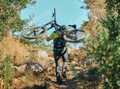 Preview: Back, man and carrying bicycle in nature, walking and traveling outdoor in woods. Sports, fitness a