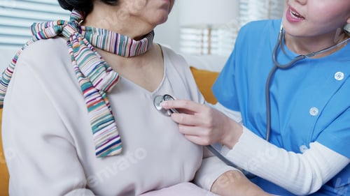 Preview: Scrub nurse doctor using stethoscope exam check heartbeat old asia female at home