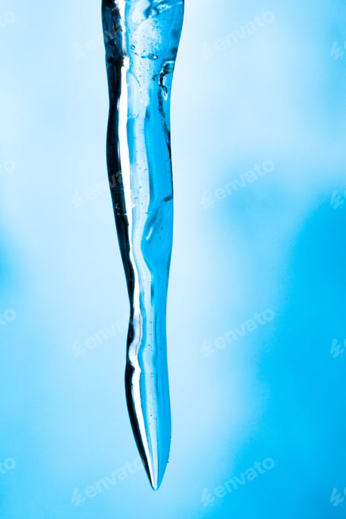 Preview: Vertical shot of a vibrant icicle with a blurry background