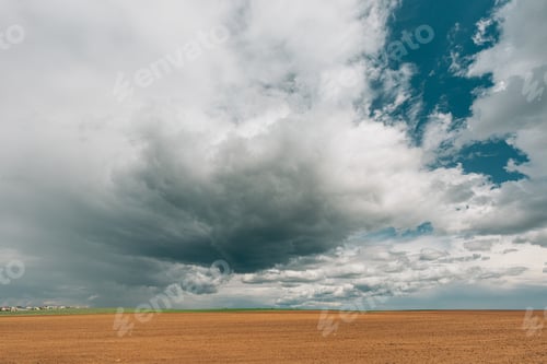 Preview: Countryside Rural Field Landscape With Empty Brown Soil. Early Spring Agricultural Season
