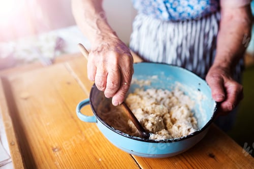 Preview: Senior woman baking