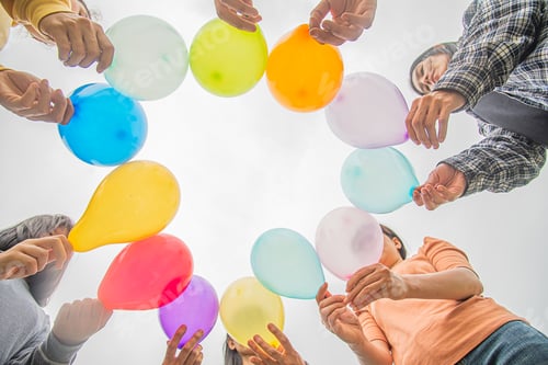 Preview: diversity group of people held colorful balloons to show unity in LGBTQ community