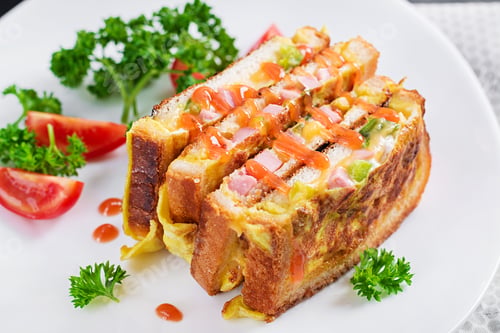 Preview: Roasted sandwich cheese,hm, peppers and scrambled eggs on white plate. Dark background.