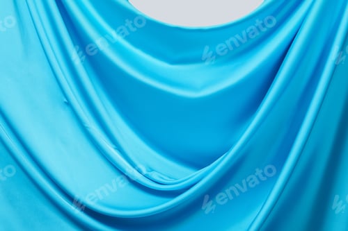 Preview: Abstract Turquoise Fabric Drape Against White Background