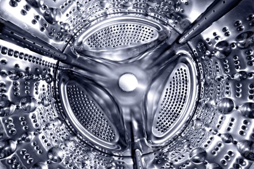 Preview: Inside of a shine steel drum of the washing or dryer machine. Laundry day. Daily household chores.