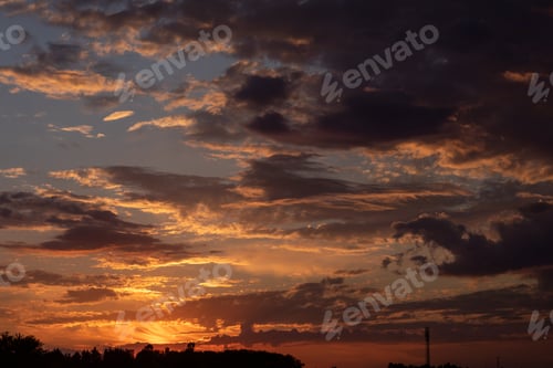 Preview: Gorgeous scenic of the sunrise or sunset with dark lining and cloud on the orange sky. Vibrant