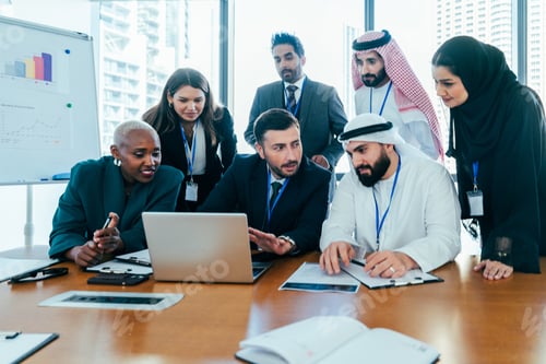 Preview: Multiethnic business team collaborating on project during office meeting