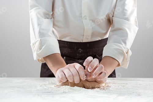 Preview: Hands kneading a dough