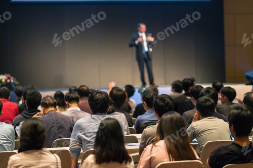 Preview: Rear side of Audiences sitting and listening the speackers on the stage in low light conference hall