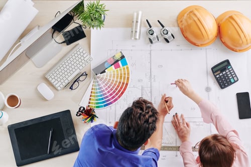 Preview: Architects working on blueprint