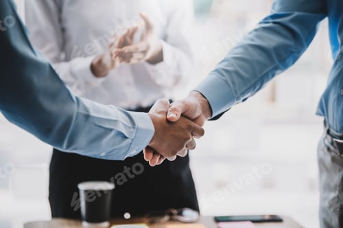Preview: Business success. Businessman shaking hands agreement confirmed in the investment business.