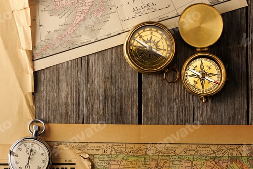 Preview: Antique compasses over old map