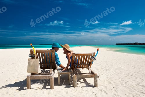 Preview: Couple Relax On A Tropical Beach At Maldives
