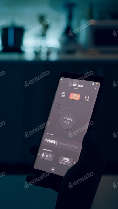 Preview: Person looking at smartphone with lights controlling software