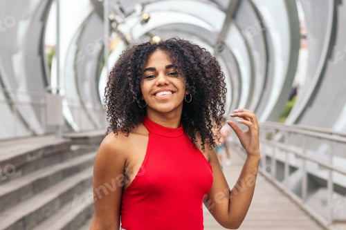 Preview: Portrait of a girl with afro hair enjoying in summer in the city