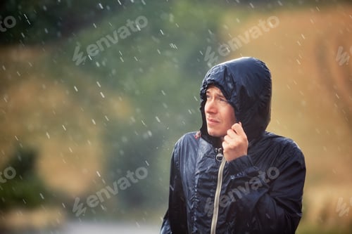 Preview: Man with dog in heavy rain