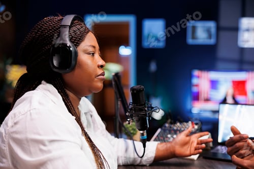 Preview: Woman using wireless headphones on show