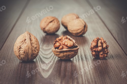 Preview: walnuts on the brown wooden table