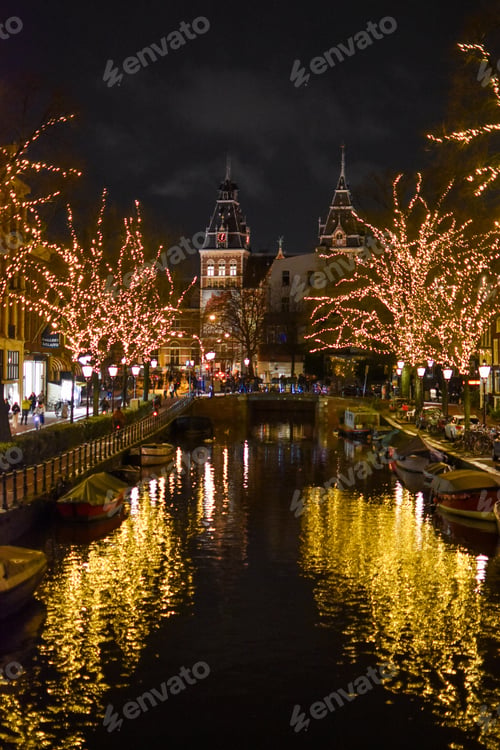 Preview: Reflection of illuminated trees on canal