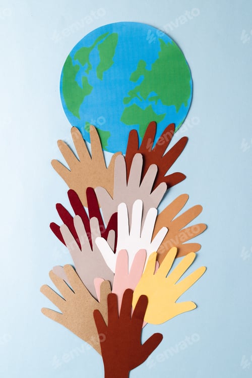 Preview: Paper cut out of multi coloured hands with globe and copy space on blue background