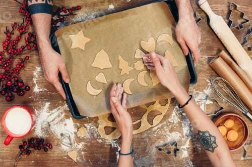 Preview: top view of couple baking delicious christmas cooking together