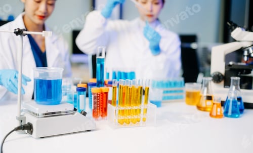 Preview: Young scientists conducting research investigations in a medical laboratory, a researcher