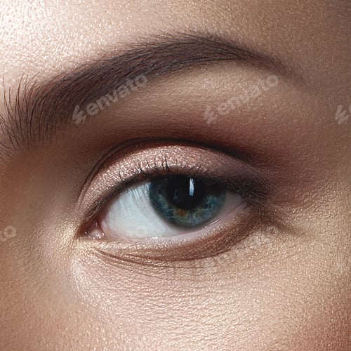 Preview: Close-up of a young caucasian female's eye with natural makeup and blue iris