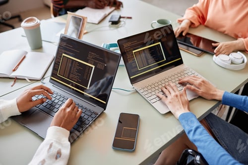 Preview: Close up of two young women writing code during meeting of IT team