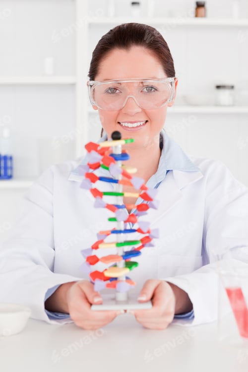 Preview: Young Scientist Showing The Dna Double Helix Model