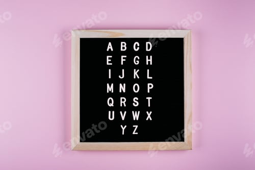 Preview: Back to school concept. Letters from A to Z on message board on pink background.