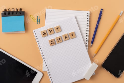 Preview: Work and study with the help of a chat bot. Words in wooden letters. Work table with open notebook.