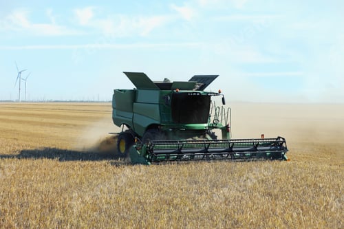 Preview: Modern combine harvester working in agricultural field