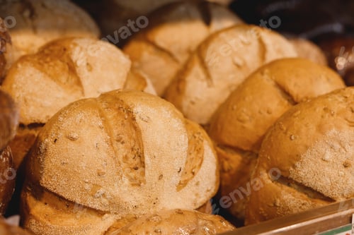 Preview: Handmade artisan bread loaves on the counter top of bakery to entice customers to buy