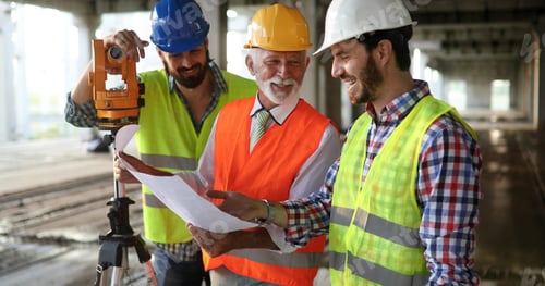 Preview: Architect and construction engineer or surveyor discussion plans and blueprints
