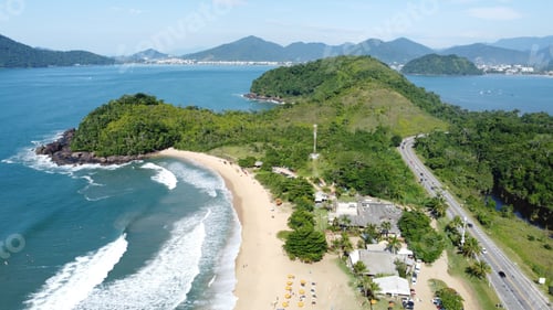 Preview: Aerial shot of a peninsula over the Atlantic ocean with roads and forests located in Ubatuba Brazil
