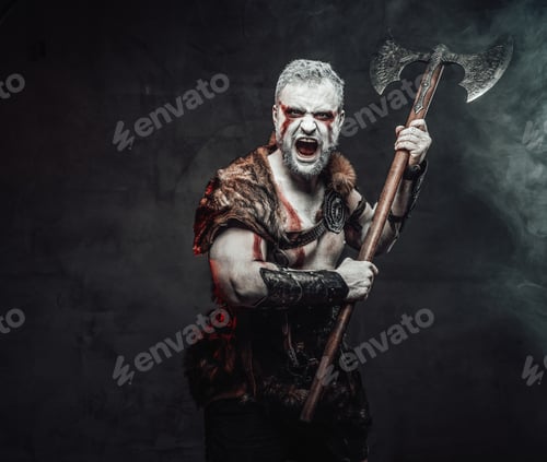 Preview: Atmospheric portrait of medieval fighter with axe in studio