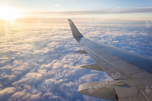 Preview: Wing passenger planes, blue sunny sky and clouds. Travel concept.