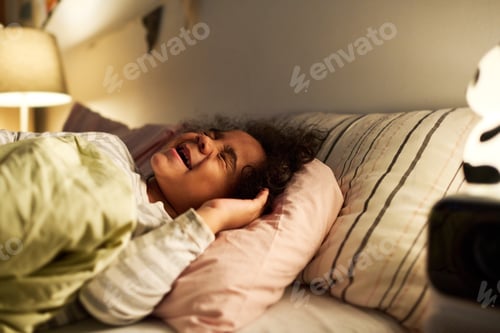 Preview: Little boy crying in his bed
