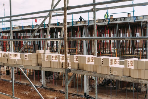 Preview: Bricks on scaffolding ready to be placed in construction site