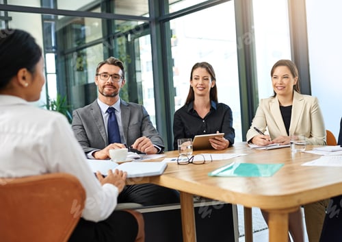 Preview: Cropped shot of a group of businesspeople meeting in the boardroom