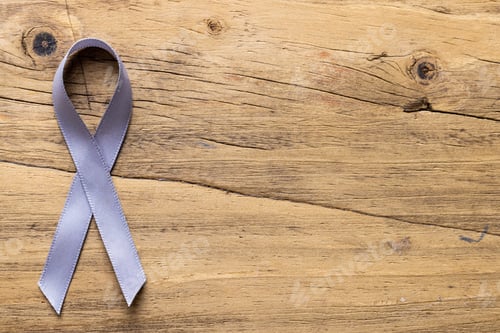 Preview: Directly above shot of blue stomach cancer awareness ribbon on wooden table, copy space
