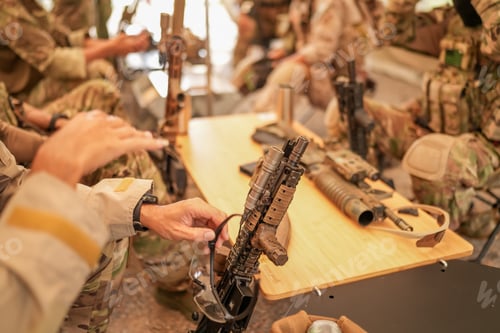 Preview: US Army Rangers group with weapons. army , planning strategy or teamwork