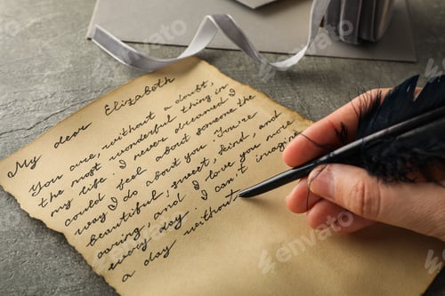 Preview: Letter with text and pen in hand on gray background, close up