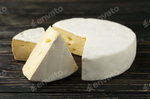 Preview: Delicious camembert cheese on wooden background, close up