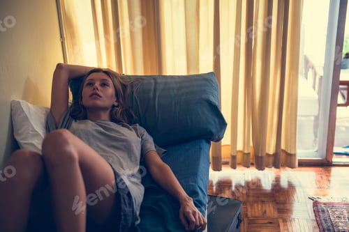 Preview: Woman lying on a bed