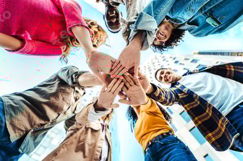 Preview: Community of young people stacking hands together