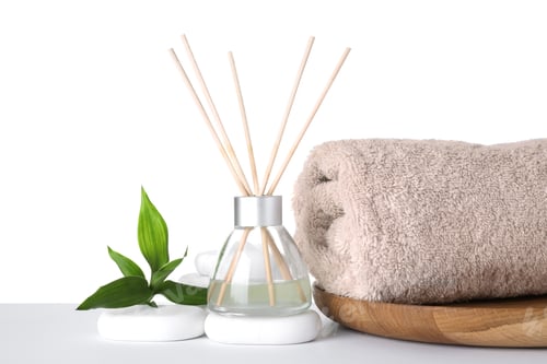 Preview: Composition with towel, air freshener and spa stones isolated on white