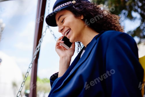 Preview: Laughing woman talking on phone