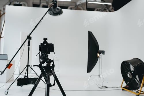 Preview: photo studio with digital photo camera, lighting equipment and fan